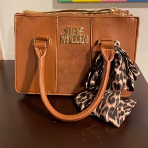 Women’s brown Steve Madden purse.